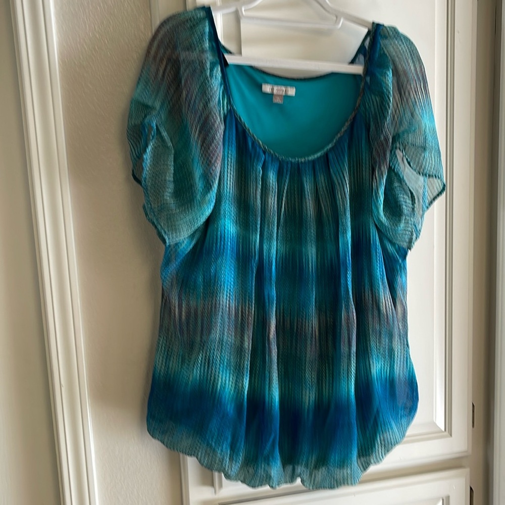 Sheer overlay blouse.